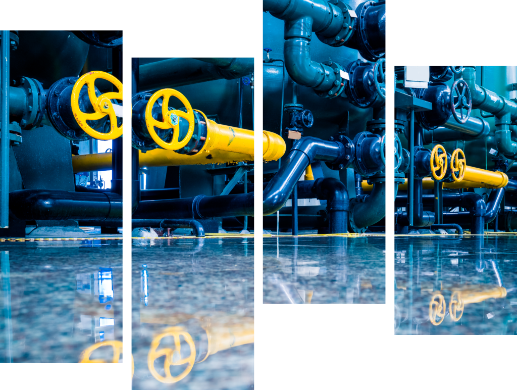 Factory floor with blue and yellow steam pipes